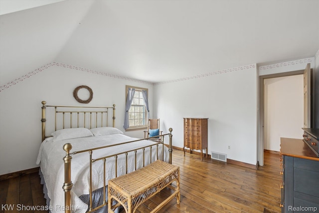 2095 E Nalone, Wixom, MI 48393 - bedroom featuring wood-type flooring, vaulted ceiling, and baseboards