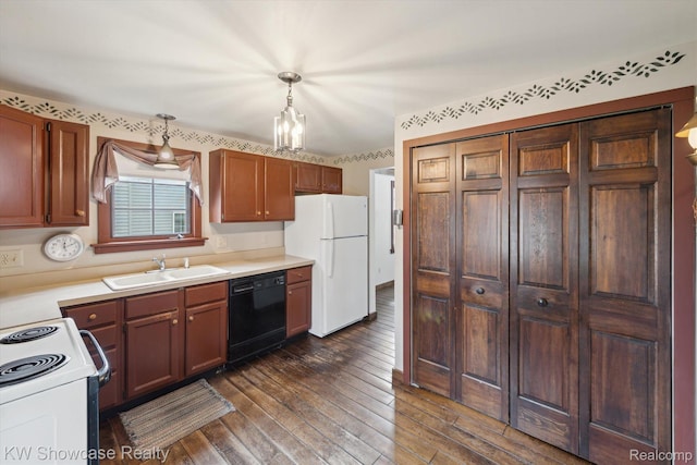 2095 E Nalone, Wixom, MI 48393 - kitchen with white appliances, a sink, dark wood finished floors, light countertops, and pendant lighting
