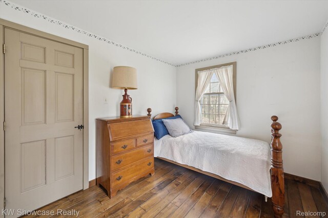 2095 E Nalone, Wixom, MI 48393 - bedroom featuring dark wood-style flooring and baseboards