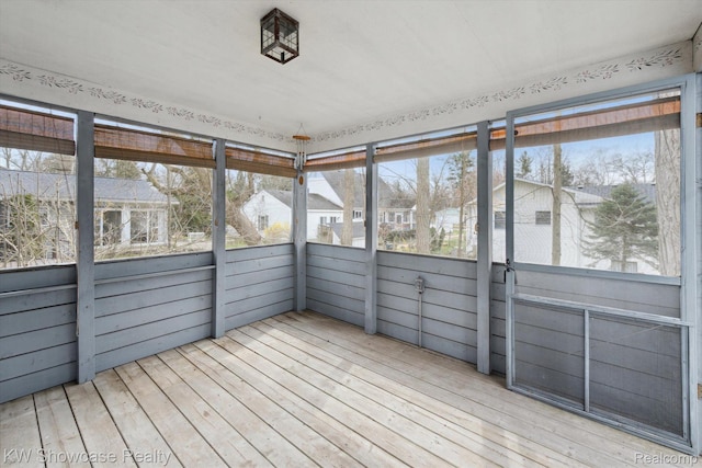 2095 E Nalone, Wixom, MI 48393 - unfurnished sunroom with healthy amount of natural light and a residential view