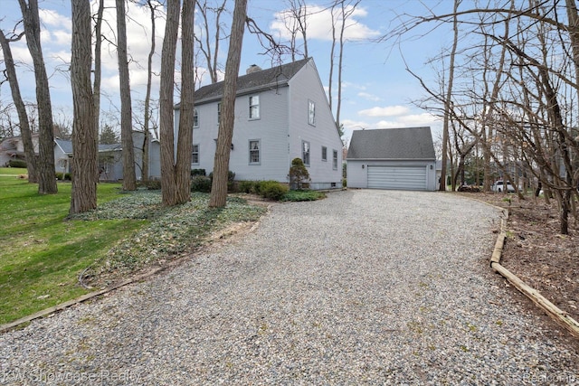2095 E Nalone, Wixom, MI 48393 - view of side of property with an outbuilding, driveway, a chimney, a yard, and roof with shingles