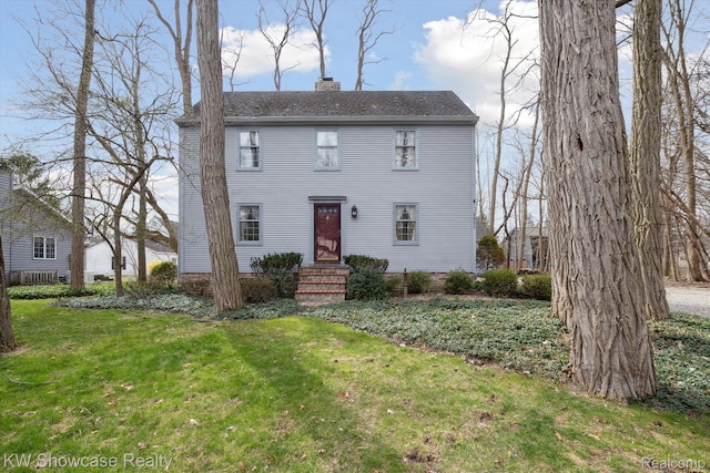 2095 E Nalone, Wixom, MI 48393 - view of front facade with a chimney, a front lawn, and roof with shingles