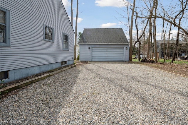 2095 E Nalone, Wixom, MI 48393 - view of home's exterior featuring an outbuilding and a garage