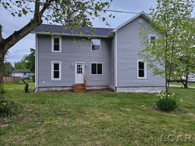 17045 Mill St, Hudson, MI 49247 - rear view of house with entry steps and a yard