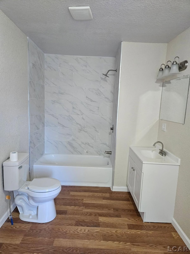 17045 Mill St, Hudson, MI 49247 - bathroom with toilet, vanity, wood finished floors, and a textured ceiling