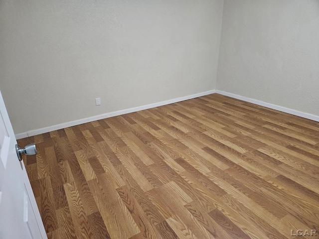 17045 Mill St, Hudson, MI 49247 - empty room with wood finished floors and baseboards