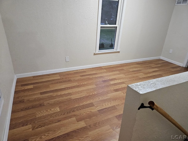 17045 Mill St, Hudson, MI 49247 - unfurnished room with wood finished floors and baseboards