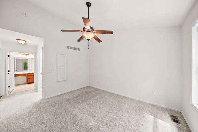 64711 Shorewood Ln, Cassopolis, MI 49031 - empty room featuring a ceiling fan, light carpet, and baseboards
