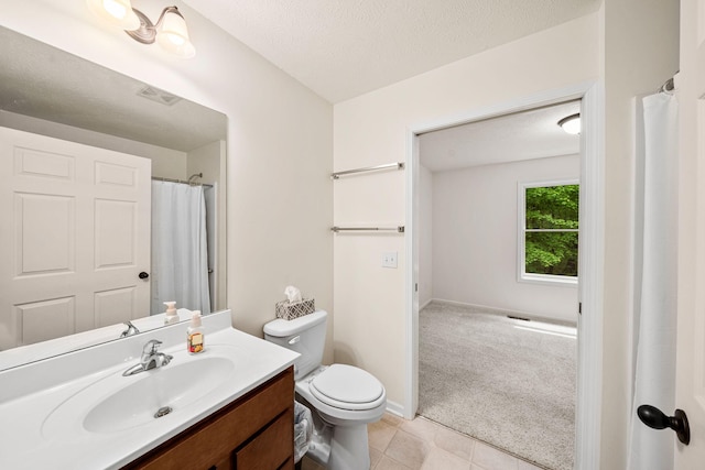 64711 Shorewood Ln, Cassopolis, MI 49031 - full bath with vanity, toilet, tile patterned flooring, and a textured ceiling