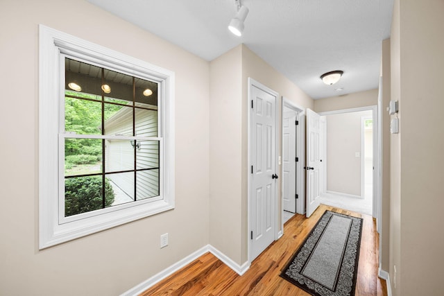 64711 Shorewood Ln, Cassopolis, MI 49031 - corridor featuring light wood-type flooring and baseboards