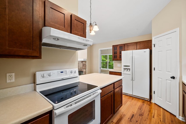 64711 Shorewood Ln, Cassopolis, MI 49031 - kitchen with white appliances, under cabinet range hood, light countertops, and light wood-style flooring