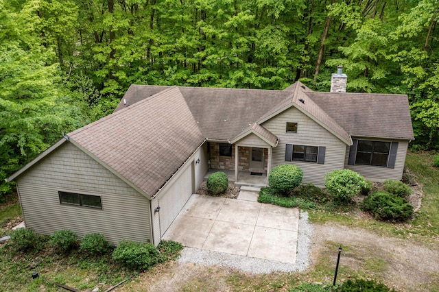 64711 Shorewood Ln, Cassopolis, MI 49031 - view of front of home with a chimney, a shingled roof, stone siding, and a porch