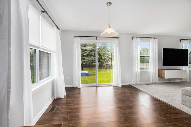 7131 Creekway Ct, Ypsilanti, MI 48197 - unfurnished living room featuring wood finished floors and baseboards
