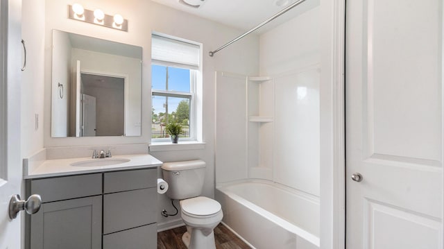 7131 Creekway Ct, Ypsilanti, MI 48197 - bathroom with vanity, toilet, washtub / shower combination, and wood finished floors