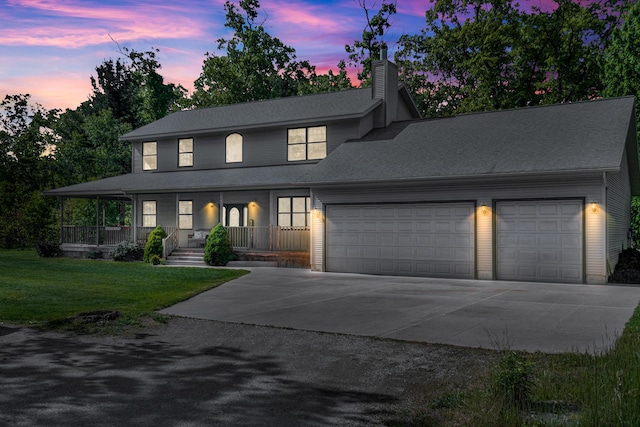 6248 Black Forest Trl, Muskegon, MI 49442 - view of front of home with concrete driveway, a garage, a chimney, a front yard, and a porch