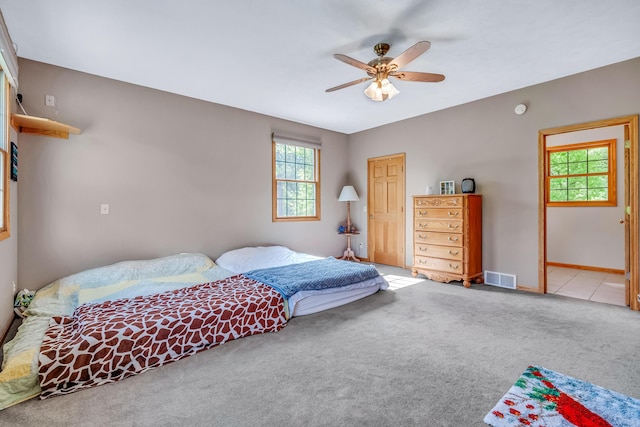 6248 Black Forest Trl, Muskegon, MI 49442 - bedroom featuring carpet floors, a ceiling fan, and baseboards