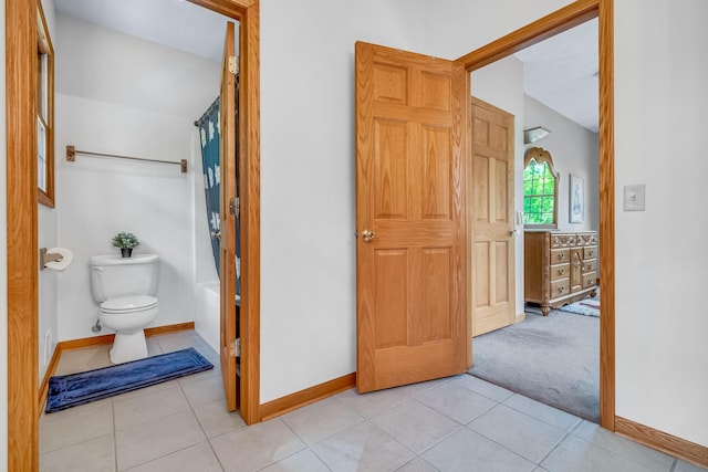 6248 Black Forest Trl, Muskegon, MI 49442 - bathroom featuring baseboards, toilet, and tile patterned floors