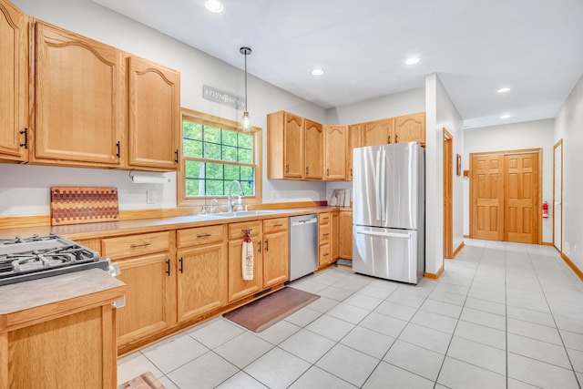 6248 Black Forest Trl, Muskegon, MI 49442 - kitchen featuring appliances with stainless steel finishes, a sink, light countertops, hanging light fixtures, and recessed lighting