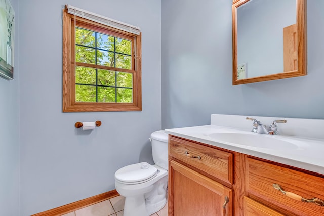 6248 Black Forest Trl, Muskegon, MI 49442 - bathroom with vanity, toilet, tile patterned flooring, and baseboards