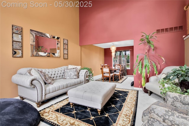 19298 Mitchell St, Rockwood, MI 48173 - living area featuring a high ceiling, carpet floors, and baseboards