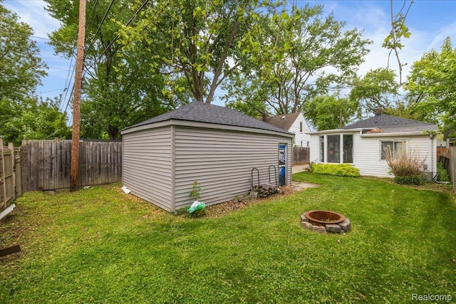 1942 E Troy St, Ferndale, MI 48220 - view of yard with an outdoor fire pit and an outbuilding