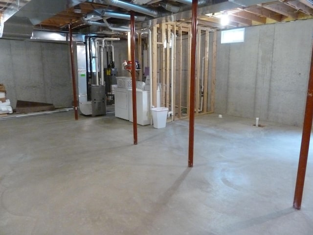 317 Monroe St, South Haven, MI 49090 - below grade area featuring washing machine and clothes dryer and heating unit