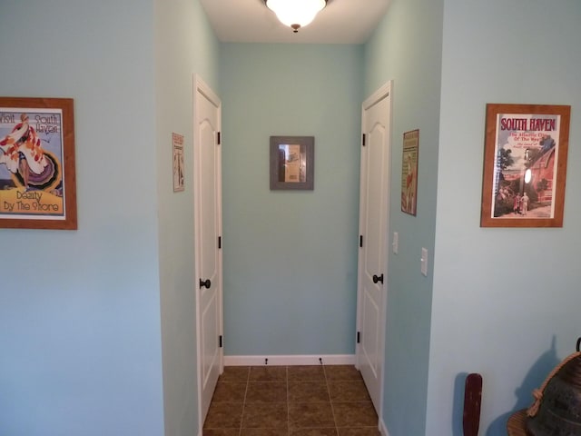 317 Monroe St, South Haven, MI 49090 - corridor with baseboards and dark tile patterned floors