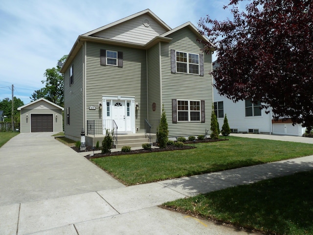 317 Monroe St, South Haven, MI 49090 - view of front of house with an outbuilding, a detached garage, concrete driveway, and a front yard