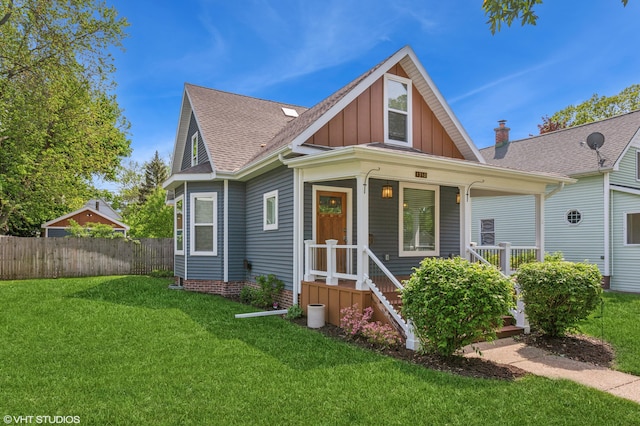 1310 Harrison Ave, Saint Joseph, MI 49085 - bungalow-style house with board and batten siding, roof with shingles, and a porch