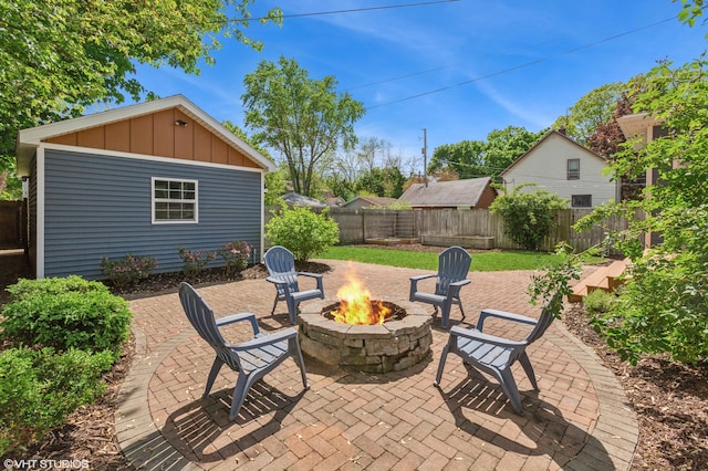 1310 Harrison Ave, Saint Joseph, MI 49085 - fenced backyard with a fire pit and a patio