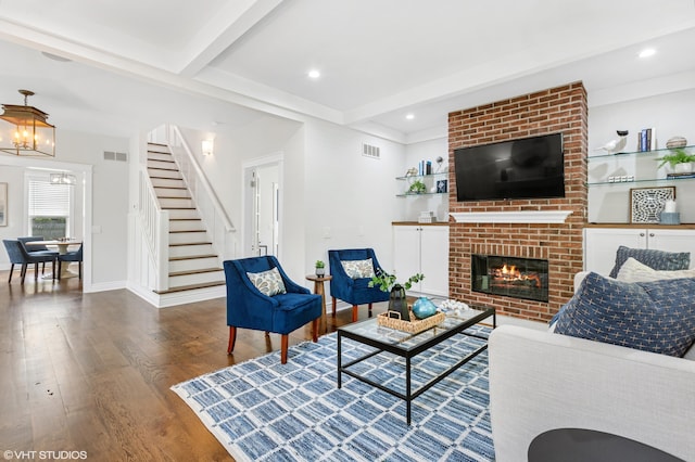 1310 Harrison Ave, Saint Joseph, MI 49085 - living area featuring stairs, beam ceiling, wood finished floors, a chandelier, and baseboards