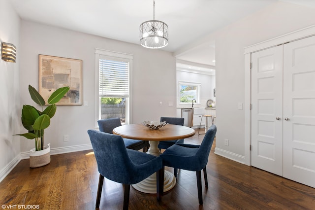 1310 Harrison Ave, Saint Joseph, MI 49085 - dining area with dark wood-style flooring, baseboards, and a chandelier
