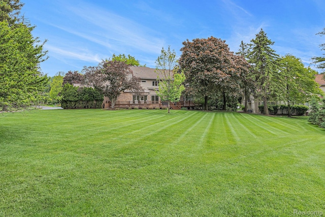 3870 Glen Falls Dr, Bloomfield Hills, MI 48302 - view of green lawn featuring a deck