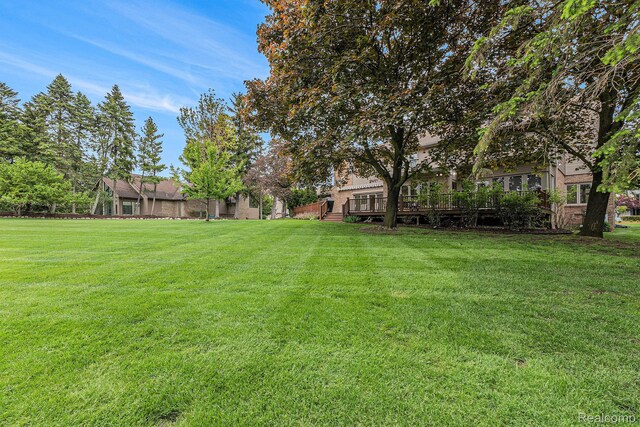 3870 Glen Falls Dr, Bloomfield Hills, MI 48302 - view of grassy yard featuring a deck