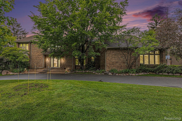 3870 Glen Falls Dr, Bloomfield Hills, MI 48302 - view of front facade with brick siding, a lawn, and asphalt driveway