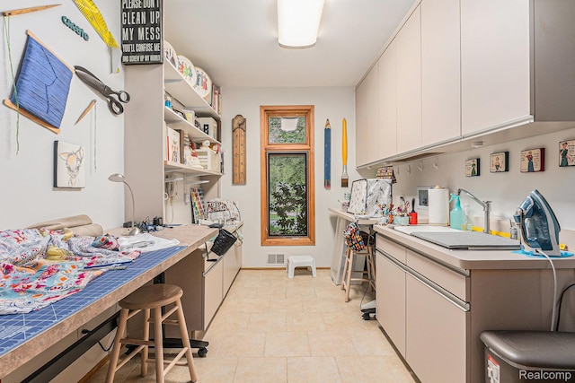 3870 Glen Falls Dr, Bloomfield Hills, MI 48302 - kitchen featuring white cabinets, a sink, and light countertops