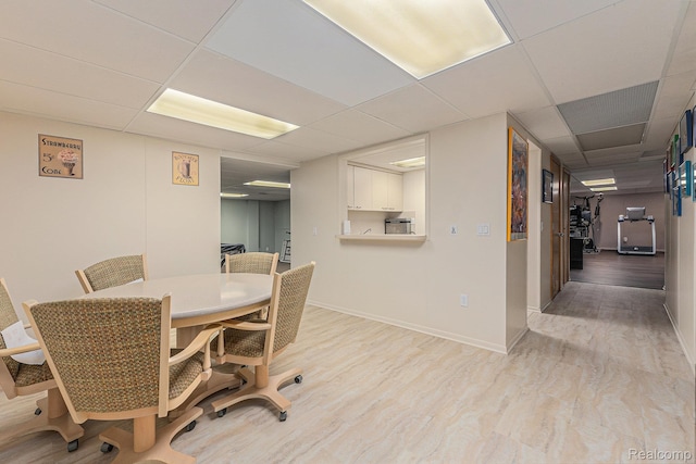 3870 Glen Falls Dr, Bloomfield Hills, MI 48302 - dining space featuring a drop ceiling, light wood-style floors, and baseboards