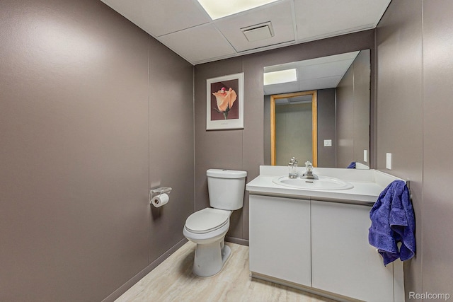3870 Glen Falls Dr, Bloomfield Hills, MI 48302 - bathroom with wood finished floors, toilet, and vanity