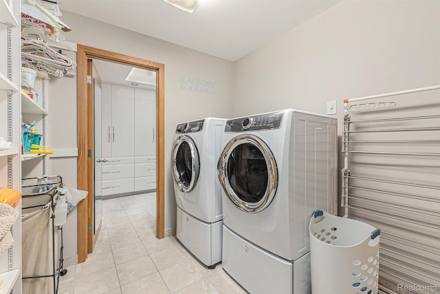 3870 Glen Falls Dr, Bloomfield Hills, MI 48302 - laundry room featuring washing machine and dryer and light tile patterned floors