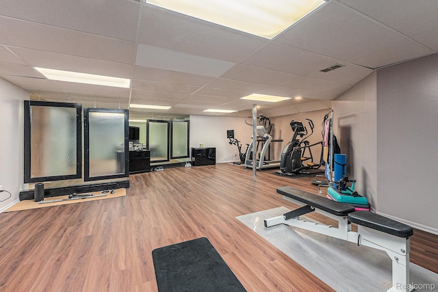 3870 Glen Falls Dr, Bloomfield Hills, MI 48302 - workout room featuring wood finished floors and a paneled ceiling