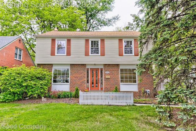 1012 W 12 Mile Rd, Royal Oak, MI 48073 - colonial house featuring brick siding and a chimney