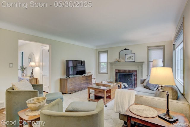 1012 W 12 Mile Rd, Royal Oak, MI 48073 - living room with healthy amount of natural light, a fireplace, baseboards, and wood finished floors