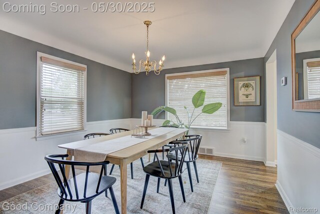 1012 W 12 Mile Rd, Royal Oak, MI 48073 - dining space with a chandelier, healthy amount of natural light, and wood finished floors