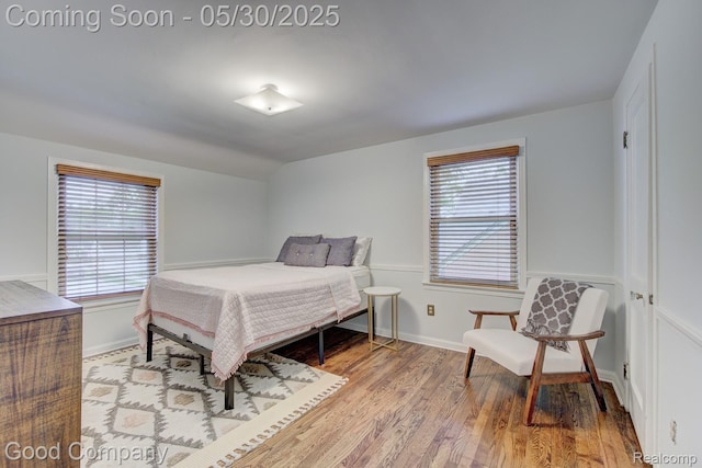 1012 W 12 Mile Rd, Royal Oak, MI 48073 - bedroom featuring wood finished floors, multiple windows, and baseboards