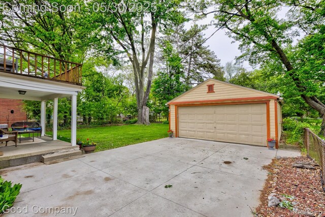 1012 W 12 Mile Rd, Royal Oak, MI 48073 - detached garage featuring view of scattered trees