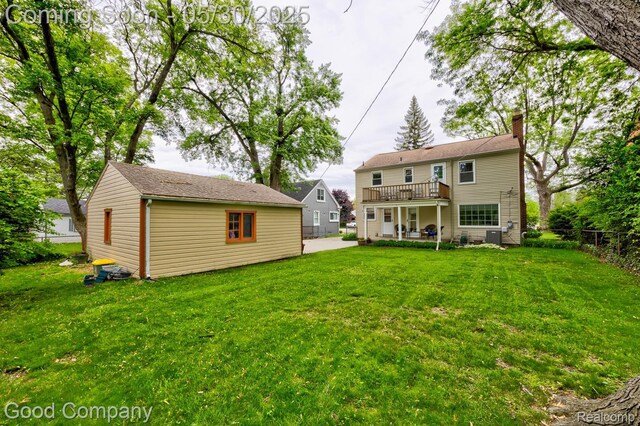 1012 W 12 Mile Rd, Royal Oak, MI 48073 - back of house featuring a chimney, an outbuilding, a patio, and a wooden deck