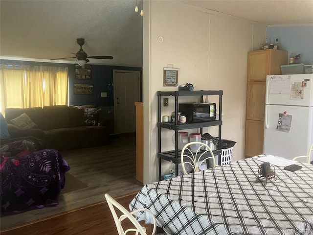 402 Katie Ln, Morrice, MI 48857 - dining area with ceiling fan, wood finished floors, and ornamental molding