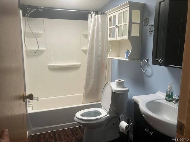 402 Katie Ln, Morrice, MI 48857 - bathroom featuring toilet, shower / bath combo, vanity, and wood finished floors