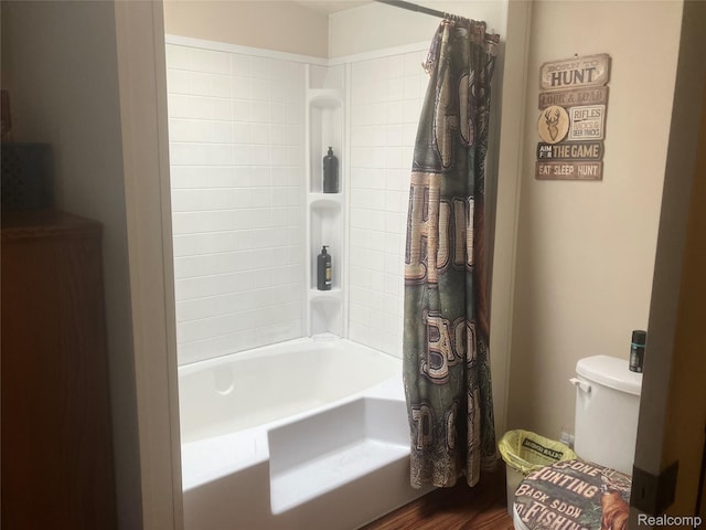 402 Katie Ln, Morrice, MI 48857 - full bathroom with wood finished floors, shower / tub combo with curtain, and toilet