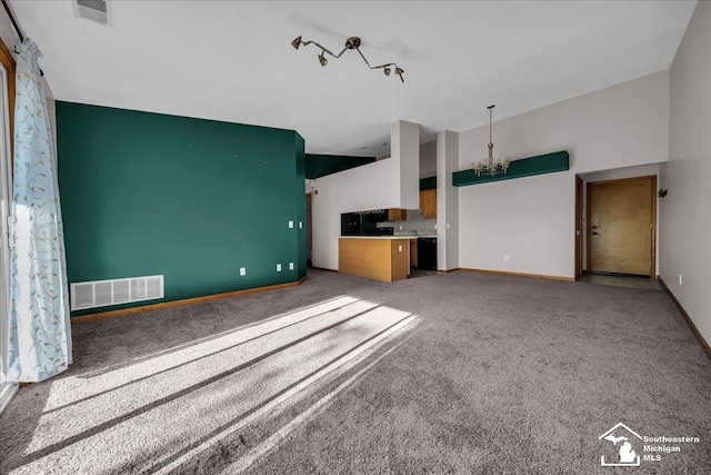 15795 Lakeside Dr, Southgate, MI 48195 - unfurnished living room with a chandelier, carpet flooring, and baseboards